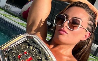 Mandy Rose Wears NOTHING (Except Her NXT Unified Titles) In Must-See New Poolside Photo