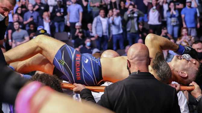 Chris Weidman Leaves UFC 261 On A Stretcher After Suffering Gruesome Leg Injury Against Uriah Hall