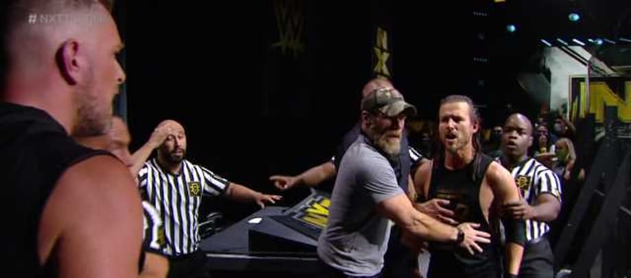 Pat McAfee Punt Kicks Adam Cole On NXT After Announce Table Confrontation